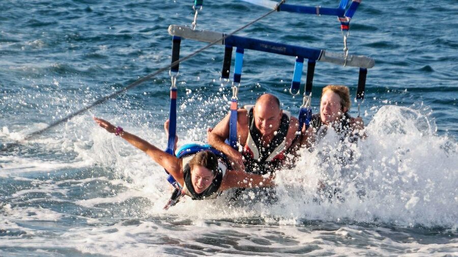 Albufeira: Single, Double or Triple Parasailing Tour - The ascent from the stern platform