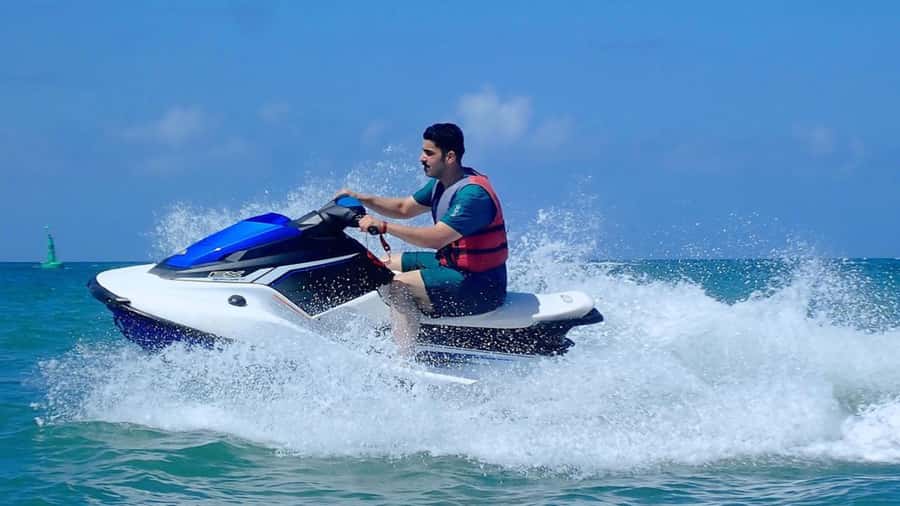 Bali: Sea Walk, Solo Jetski and Parasailing with Pickup - Parasailing above the turquoise water