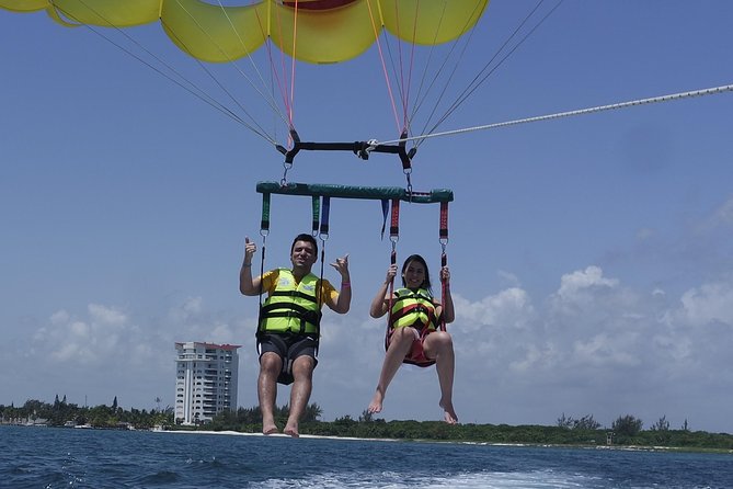 Cancun Adventure: Reef Snorkeling & Parasailing Experience - Group size, pickup, and timing