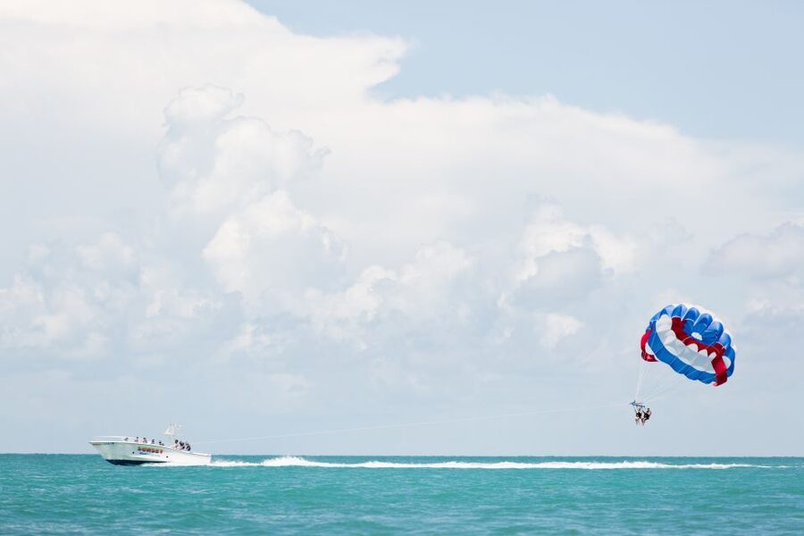 Key West Parasailing at Smathers Beach - Rising from Smathers Beach into open sky