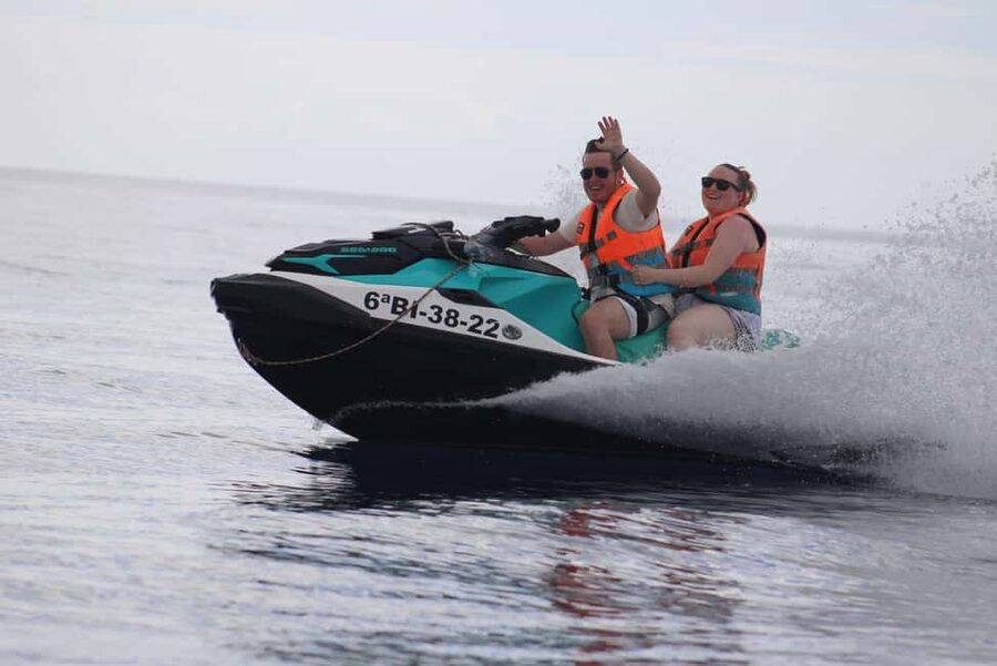 PACK TRIO Buggy, Jet Ski, and Parasailing Adventure - Parasailing above the water